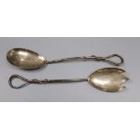 A pair of Edwardian silver salad servers with loop twist handles, by John Charles Grinsell,