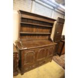 An 18th century oak mule chest with associated rack, width 151cm, depth 54cm, height 180cm