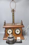 An Art Deco chromium desk calendar/barometer and a mahogany table lamp with thermometer and