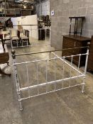 A late Victorian iron and brass double bed frame, width 54cm height 141cm