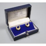 A pair of modern 18ct gold and ruby set horseshoe shaped cufflinks by Mappin & Webb, London, 1989,