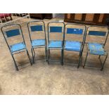 Four painted metal stacking chairs