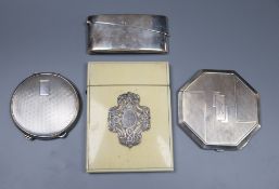 A George V silver concave card case, 82mm, two silver compacts including Art Deco with engraved