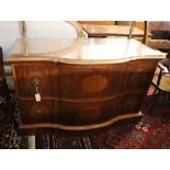 An inlaid walnut chest of shaped form, fitted two long drawers on plinth base, width 124cm, depth