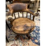 A Victorian leather upholstered mahogany swivel desk chair