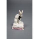 A rare Staffordshire porcelain figure of a cat seated on a cushion, c.1835-50, 6cmCONDITION: Typical