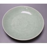 A 19th century Chinese celadon 'lotus' dish, diameter 33cm (faults)CONDITION: Crack inward from rim,