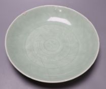 A 19th century Chinese celadon 'lotus' dish, diameter 33cm (faults)CONDITION: Crack inward from rim,