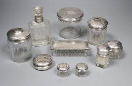 A small Edwardian silver pot pourri box, 52mm and nine other assorted silver mounted glass toilet