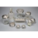 A small Edwardian silver pot pourri box, 52mm and nine other assorted silver mounted glass toilet