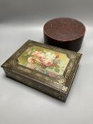 A Burmese red lacquered cylindrical box and a William Crawford biscuit tin (2)