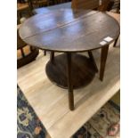 An 18th century pine cricket table, with undertier, 63cm diameter, height 56cm