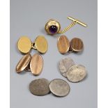 A pair of 9ct gold cufflinks, 5.4 grams, an 18ct cufflink, 5.7 grams, a 14k and amethyst dress stud,