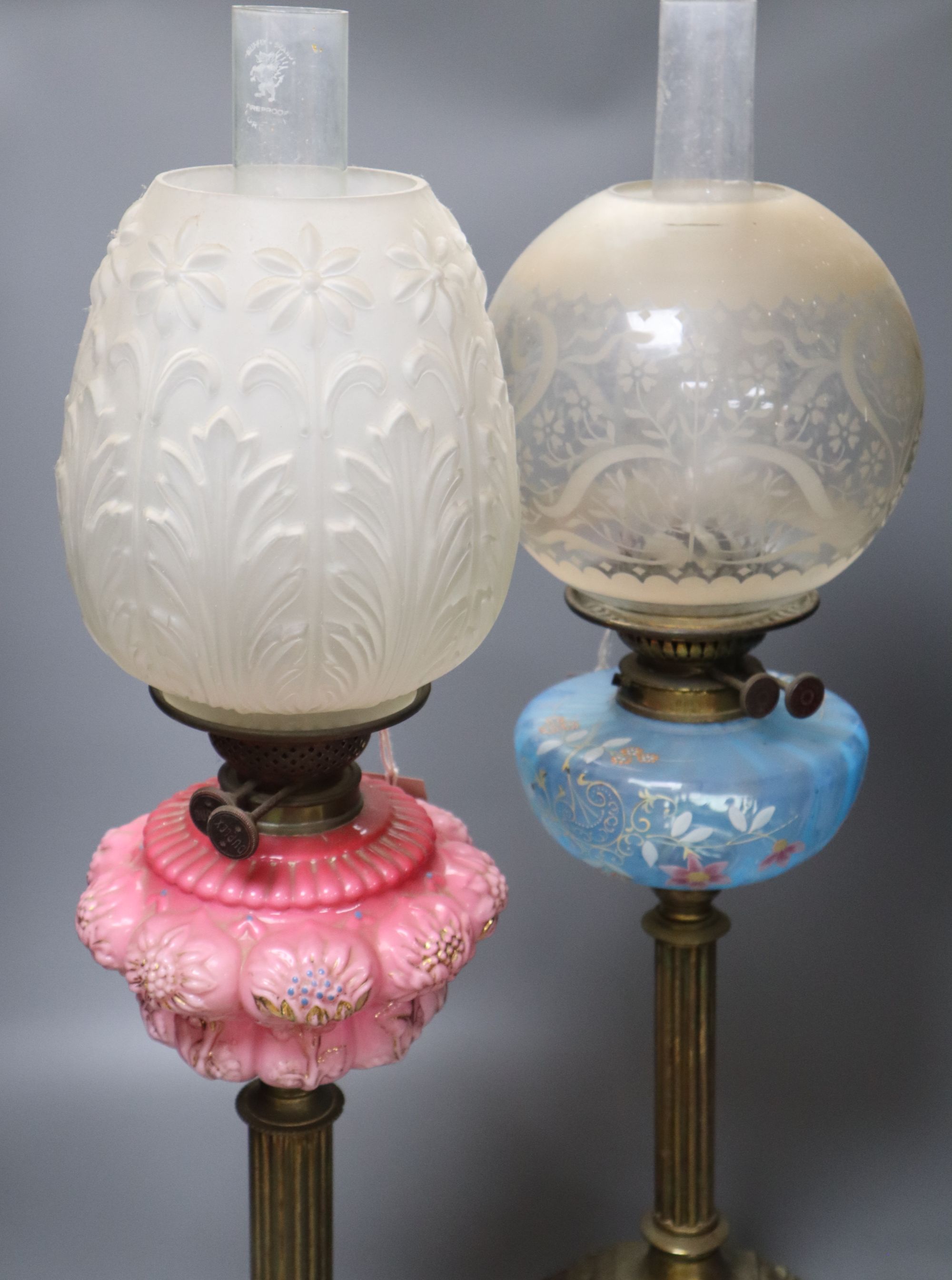 Two 19th century oil lamps, tallest 68cm including funnelCONDITION: Generally good; pink opaline - Image 2 of 3