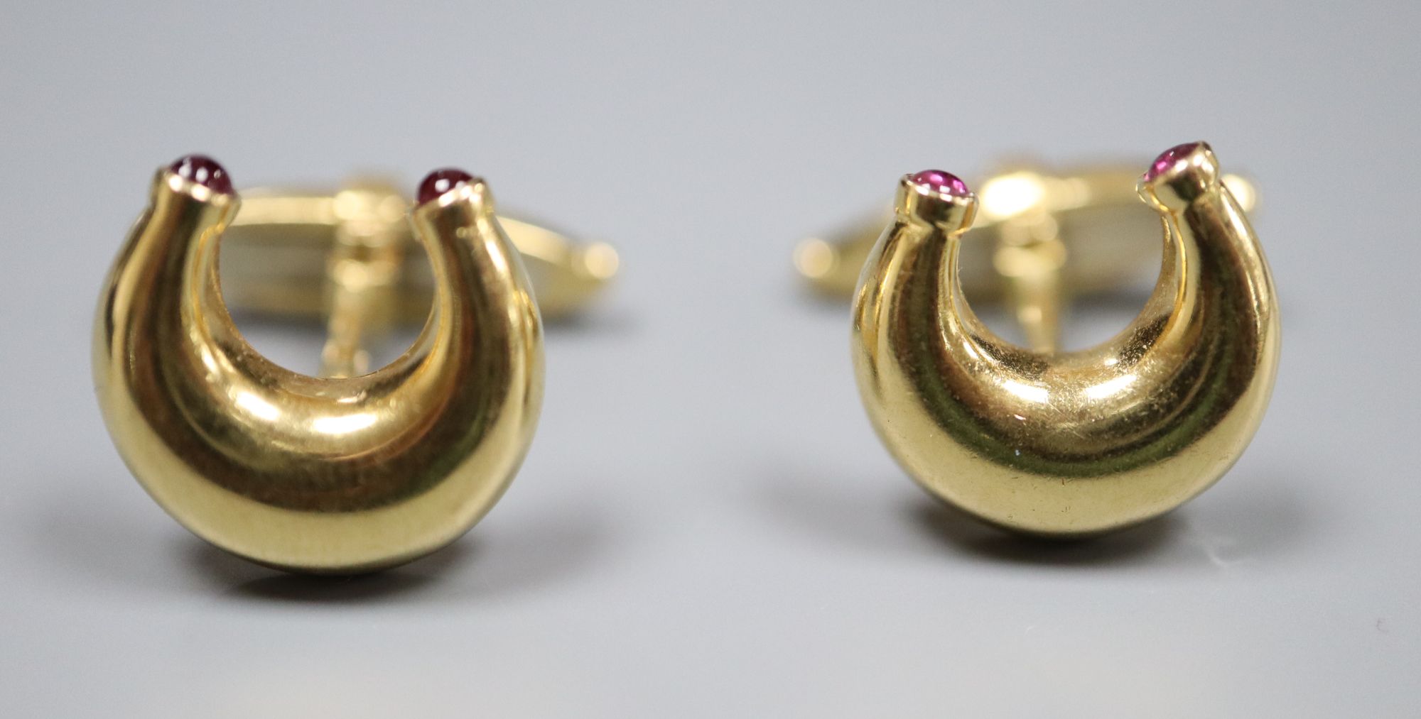 A pair of modern 18ct gold and ruby set horseshoe shaped cufflinks by Mappin & Webb, London, 1989, - Image 2 of 4