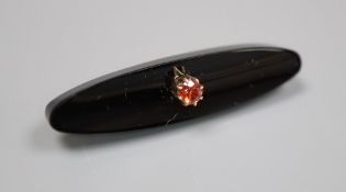 An early 20th century Russian 56 zolotnik yellow metal, black onyx and orange stone set ovoid