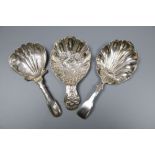 Three 19th century silver caddy spoons including embossed by Joseph Wilmore, Birmingham, 1825,