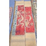 A pair of Antique Chinese silk and gold threadwork panels depicting dragons over waves, 38 x 150cm