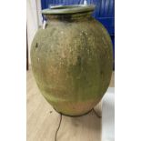 An early 20th century Portuguese pottery oil jar on stand, with bespoke glazed pottery top insert