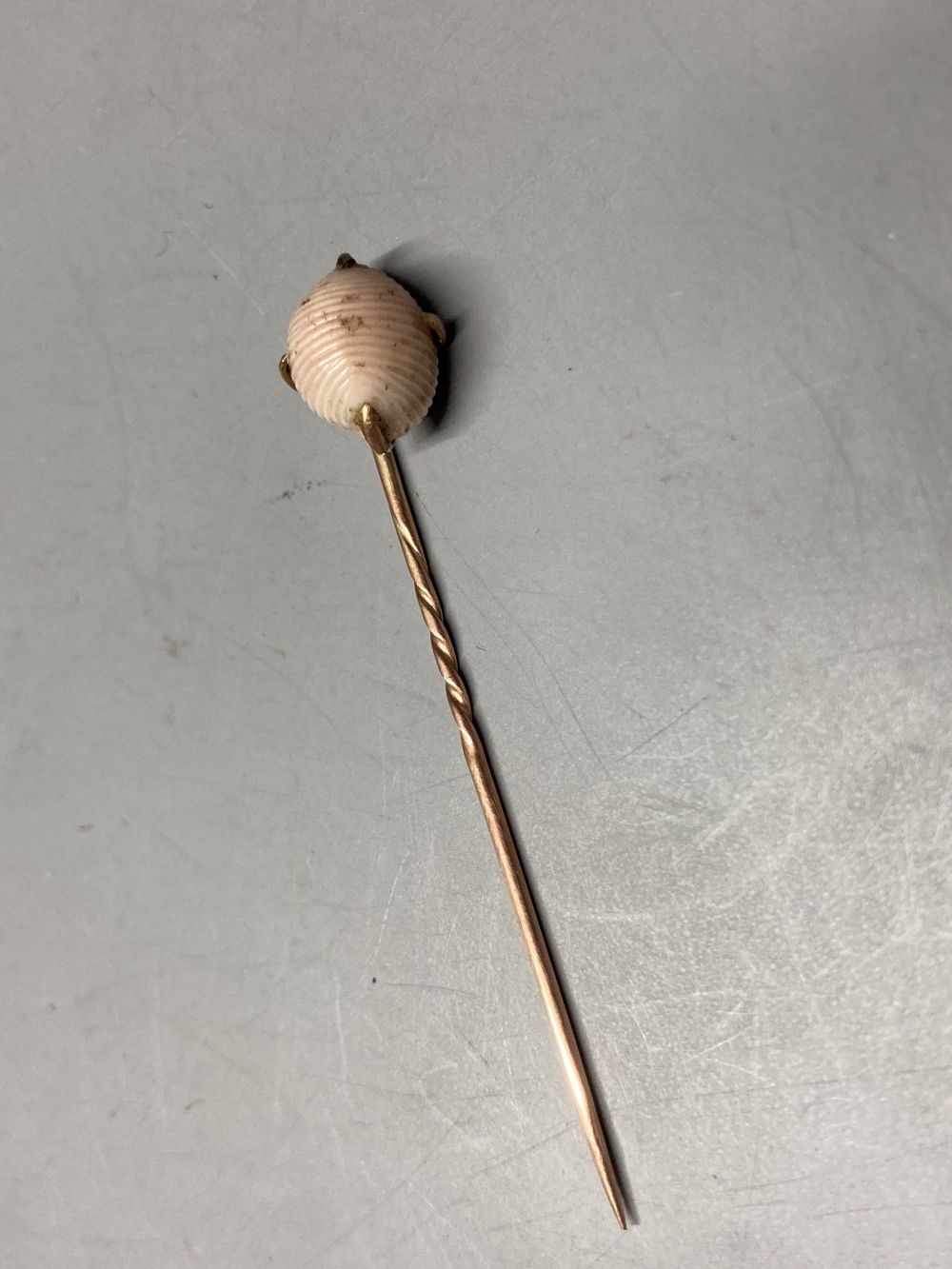 A cased early 20th century yellow metal and carved sardonyx set stick pin, 8cm and a similar 'shell' - Image 4 of 4