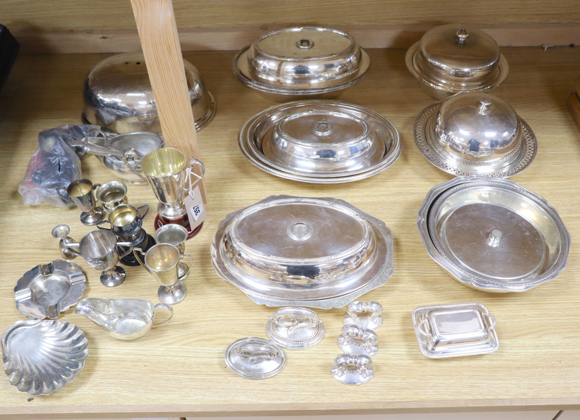 A quantity of plated items, including entree dishes and covers, two muffin dishes and covers and