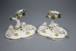 Two similar Staffordshire porcelain models of sheep recumbent beneath a tree, c.1835-50, possibly