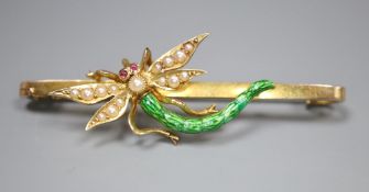 An Edwardian yellow metal, garnet?, seed pearl and green enamel set dragonfly bar brooch, 51mm,