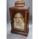 A George III-style mahogany mantel clock, 5.75 inch arched dial, gong striking movement, with key