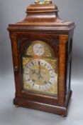 A George III-style mahogany mantel clock, 5.75 inch arched dial, gong striking movement, with key