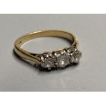 A mid 20th century 18ct and three stone diamond ring, size K/L, gross 2.7 grams.CONDITION: Some