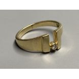 A modernist continental 585 yellow metal and single stone diamond ring, size O/P, gross 4 grams.