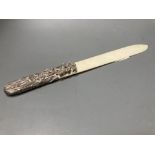 A Chinese? pierced white metal mounted ivory paper knife (a.f.), 33.6cm.CONDITION: Handle mounted