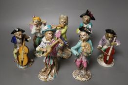 Six 19th century Meissen monkey band figures and another Volkstedt example, tallest 15cm