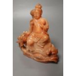 A Chinese chalcedony carving of Guanyin and a dragon, 13.5cm high