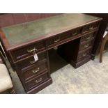 A late Victorian mahogany pedestal desk, stamped J. Shoolbred, width 122cm depth 55cm height 75cm