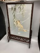 A Chinese carved hardwood framed table screen, the panel silk embroidered with a kitten at play,