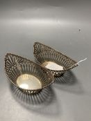 A pair of early 20th century Dutch pierced 833 standard white metal boat shaped bonbon dishes, 14.