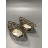 A pair of early 20th century Dutch pierced 833 standard white metal boat shaped bonbon dishes, 14.