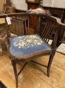 A Victorian inlaid mahogany corner elbow chair