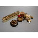 Four Tunbridgeware needlework accessories, a Tunbridgeware clothes brush, a miniature measure, a
