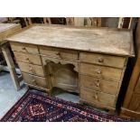 A Victorian pine kneehole desk, width 128cm depth 55cm height 82cm