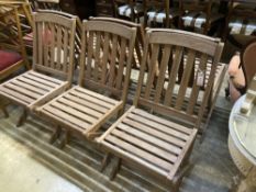 A set of six teak folding garden chairs