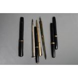 Four small fountain pens including two Swan, an engine turned silver pencil and two other items