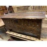 An elm and oak six plank coffer with lunette carved front, width 112cm depth 36cm height 58cm