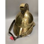 A reproduction brass fireman's helmet, height 27cm