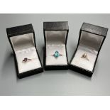 Three assorted modern 9ct or yellow metal and gem set dress rings, including white gold and marquise