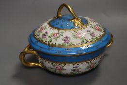 A 19th century Paris porcelain handled bowl and cover painted with roses under turquoise borders,