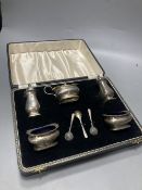 A late 1950's cased silver five piece condiment set, with three spoons, Birmingham, 1957.