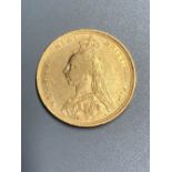 A Victoria 1889 gold sovereign, F or better.