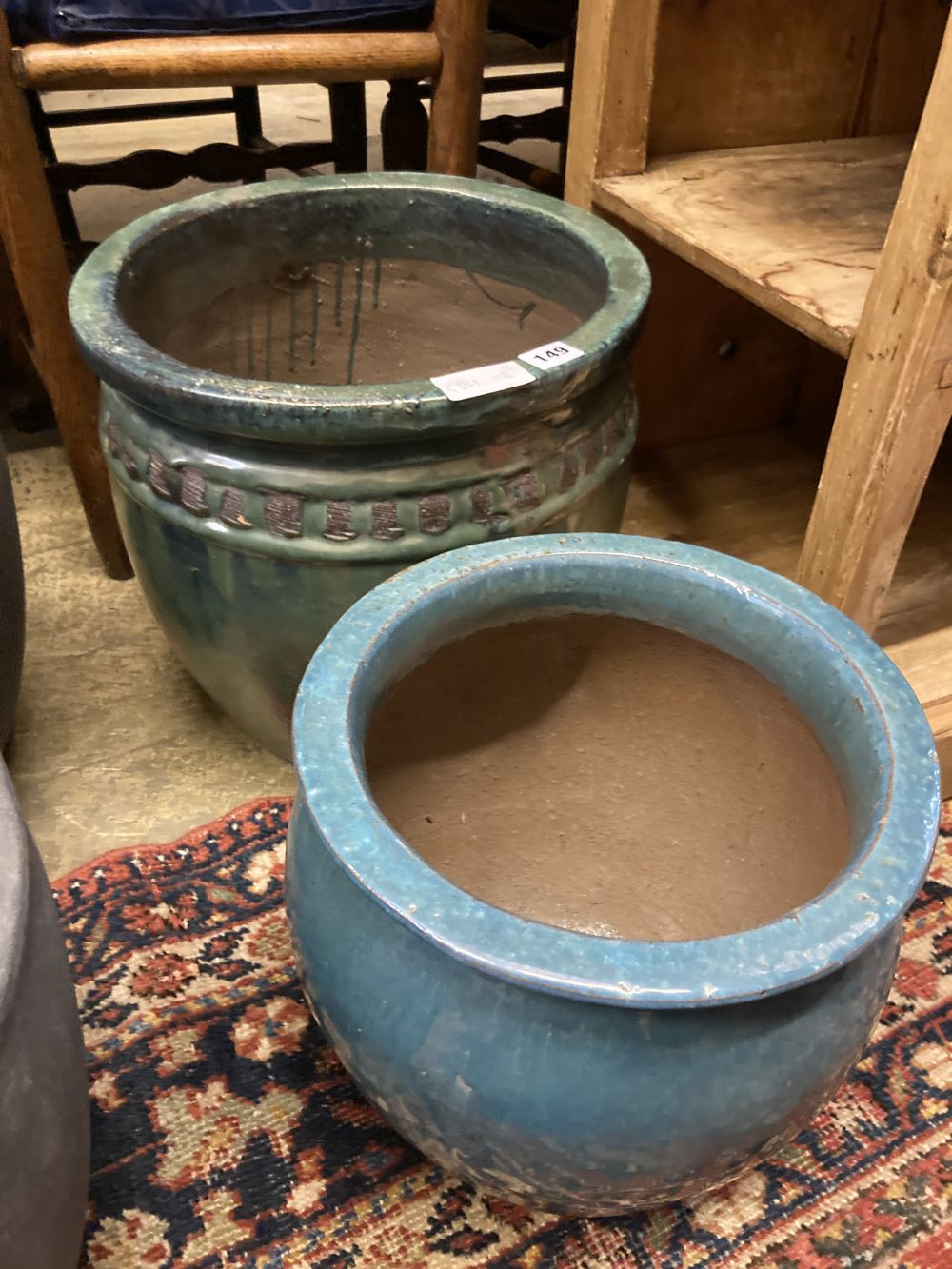 Two glazed earthenware garden planters, largest diameter 37cm